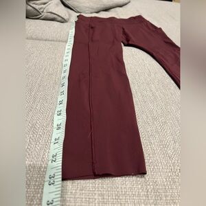 Maroon Lululemon 7/8 legging with side pockets and adjustable waist.